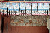 Ladakh - Alchi monastery, mural paintings of the cortyard of the main temple entrance 